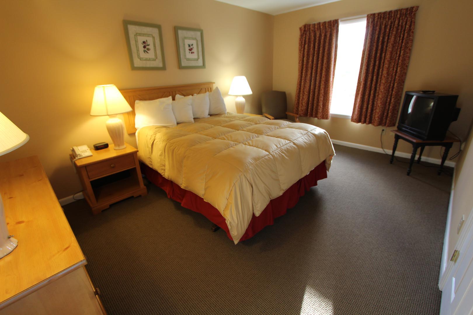 a comfy bedroom at VRI's Lake Placid Club Lodges in New York.